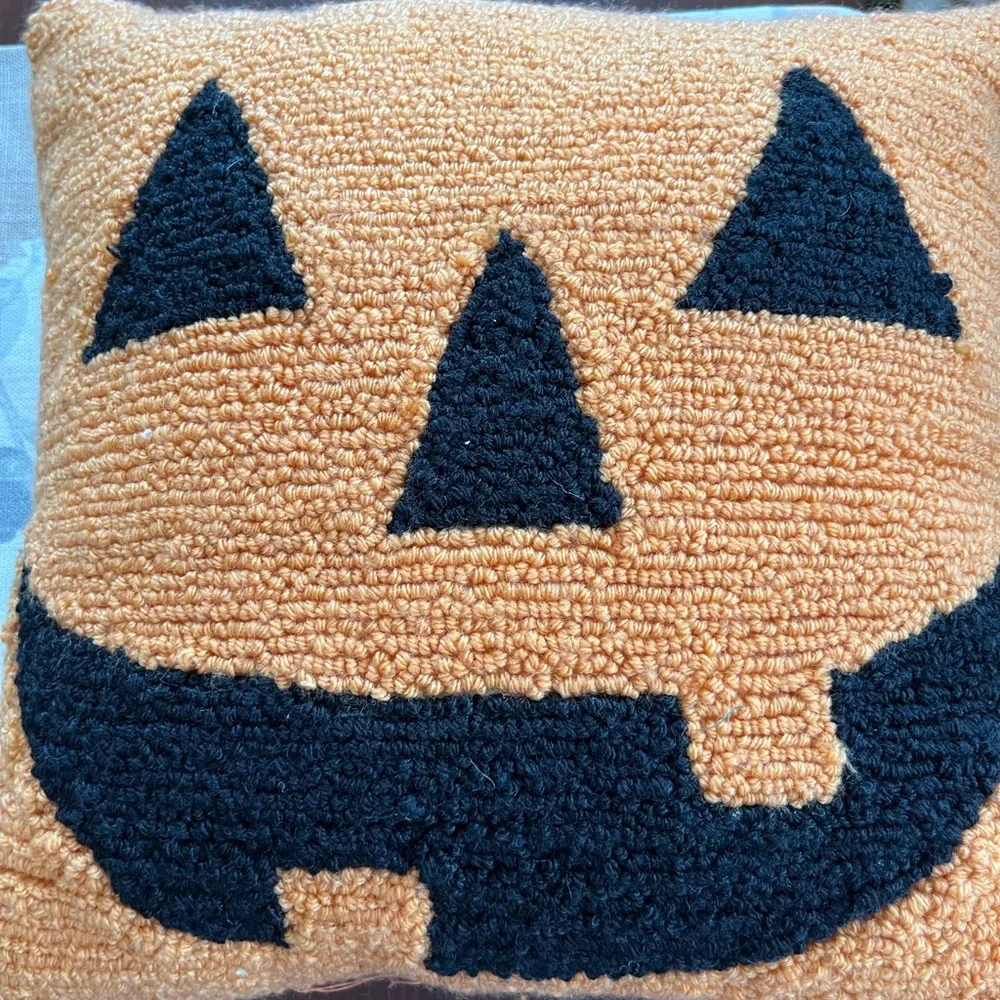 The Midnight Market Orange Knit seasonal pillow. Measures 12” by 12”